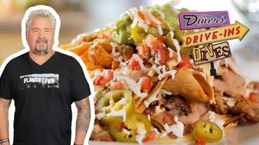 VIDEO: Guy Tries Highland Nachos with Carnitas at a Ski Resort | Diners, Drive-Ins and Dives | Food Network