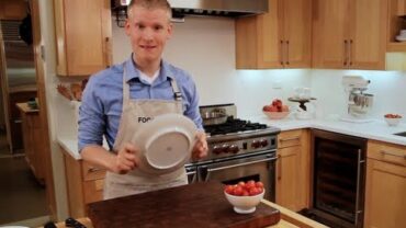 VIDEO: How to Cut Cherry Tomatoes with Two Plates | Food & Wine
